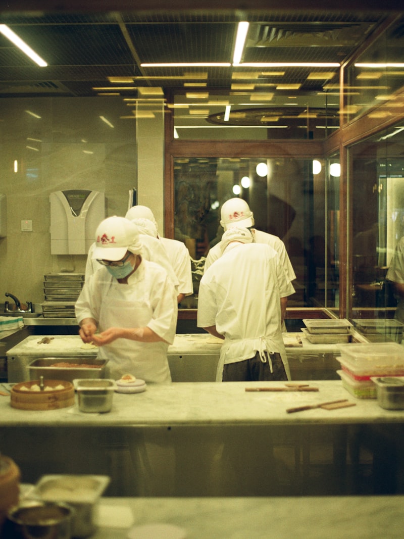 Two cooks working together in a professional kitchen