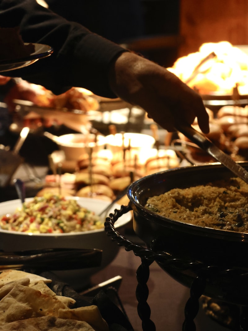 A chef cooking to order in pans at a live station
