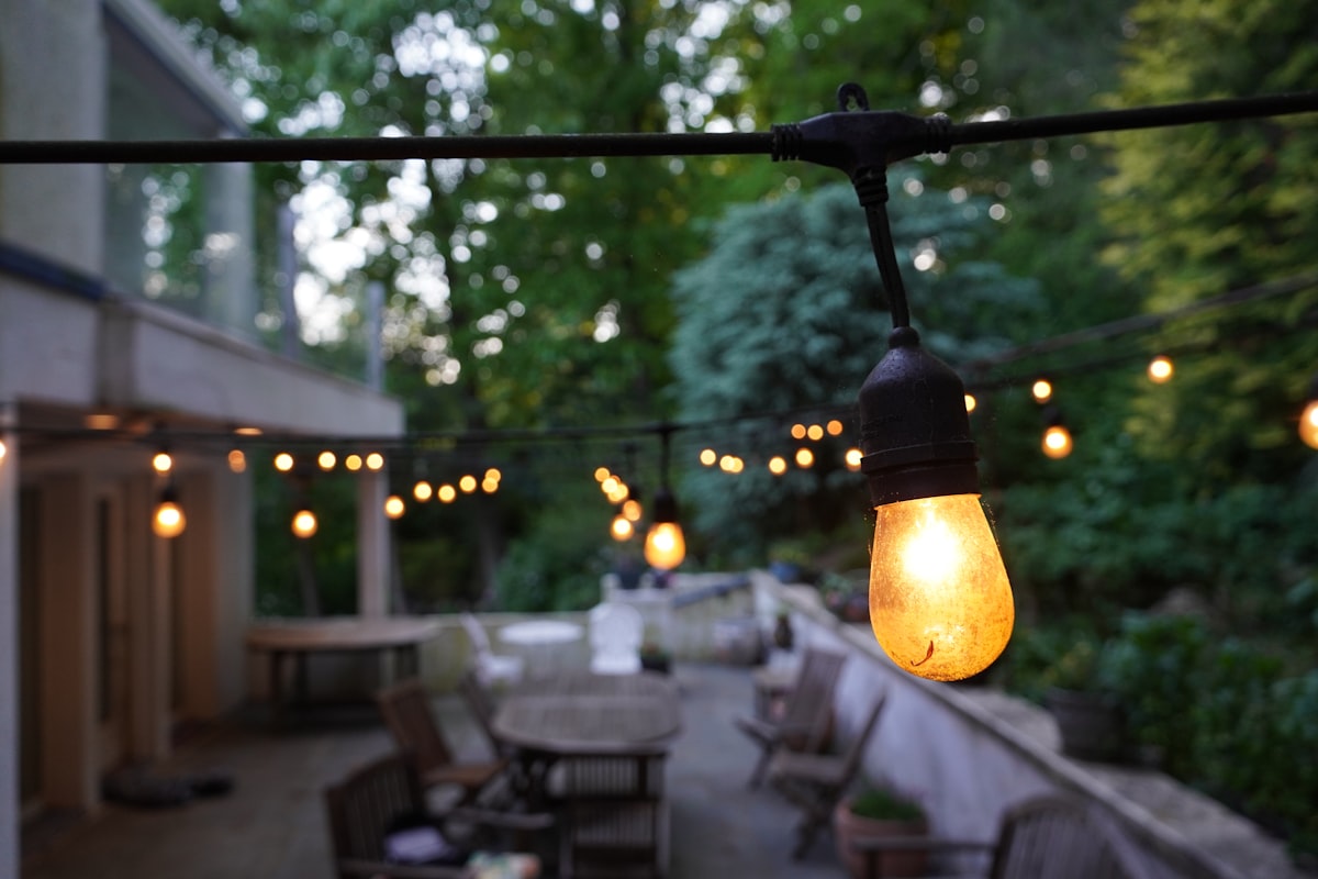 String lights strung above an outdoor party table