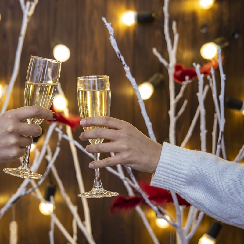 Guests raising champagne flutes in a toast under warm lights