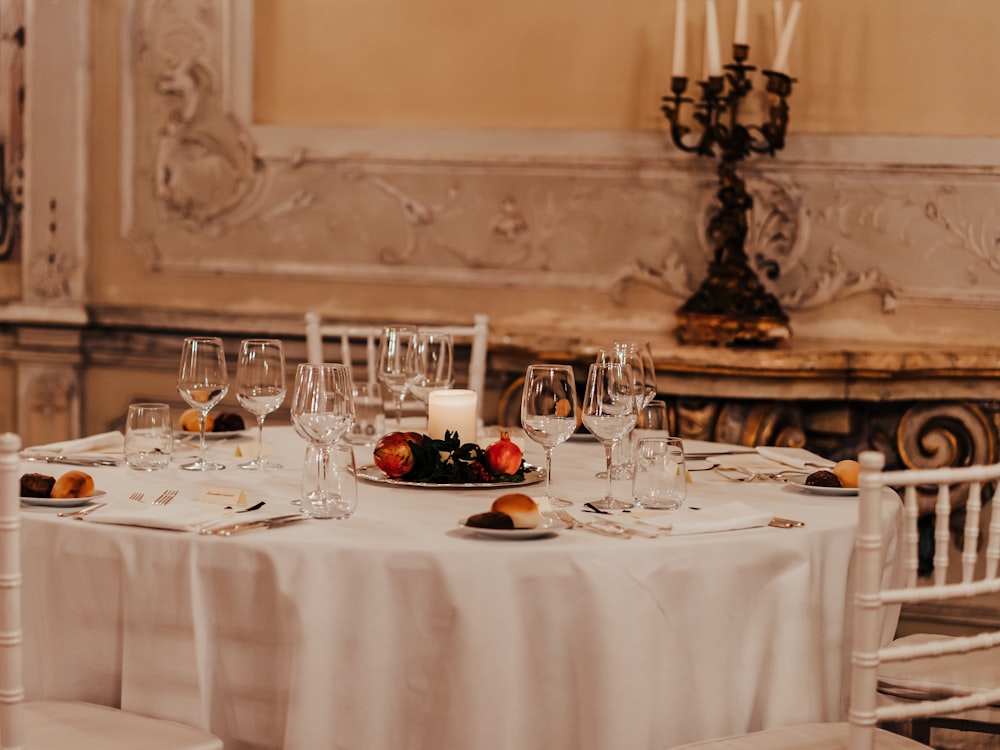An elegant wedding table set with candelabra and glassware